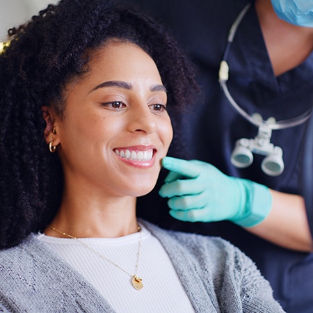 Female patient smiling after a dental checkup and cleaning