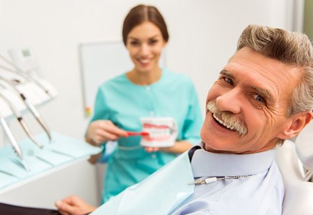 Older man happy with the health and aesthetics of his smile